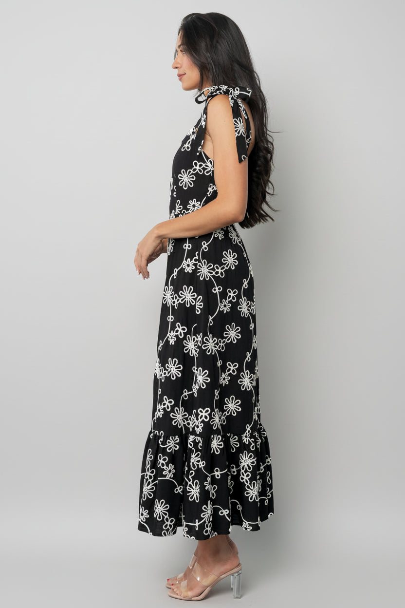 Detail view of tiered midi skirt with three ruffled tiers and soft movement in medium-weight rayon fabric.