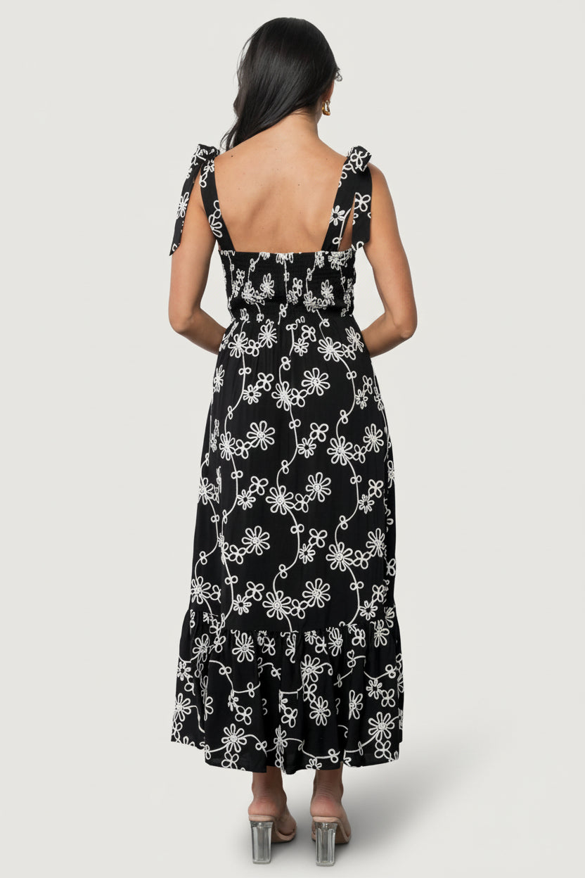 Side view of Amor Midi Dress showing paneled front bodice, gentle A-line silhouette, and layered ruffled tiers.
