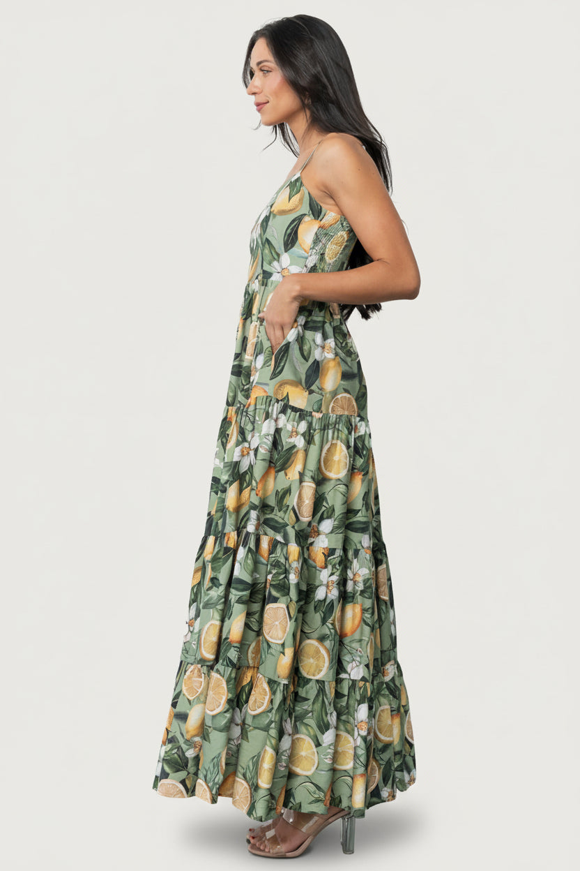 Back view of the Silvia dress highlighting the smocked back panel and adjustable spaghetti straps with textured fabric detail.