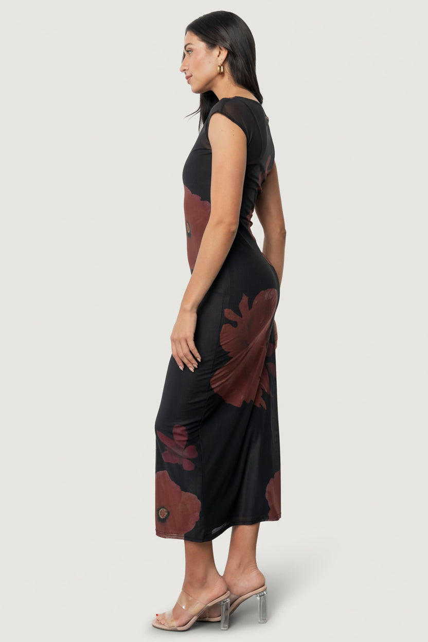Styled look of Daniela mesh midi dress for evening wear, focusing on silhouette and how the slip layers beneath the sheer overlay.