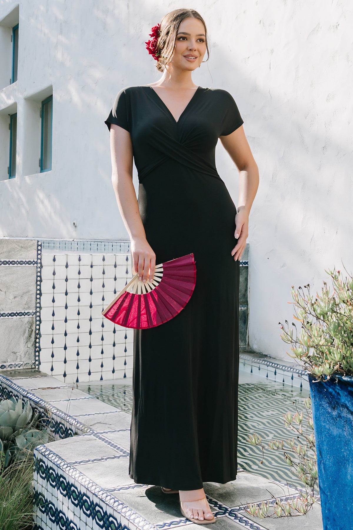 Back and side view of the Annaeli maxi dress on model, showing short sleeve length, elasticated waist, and flowing unlined skirt.