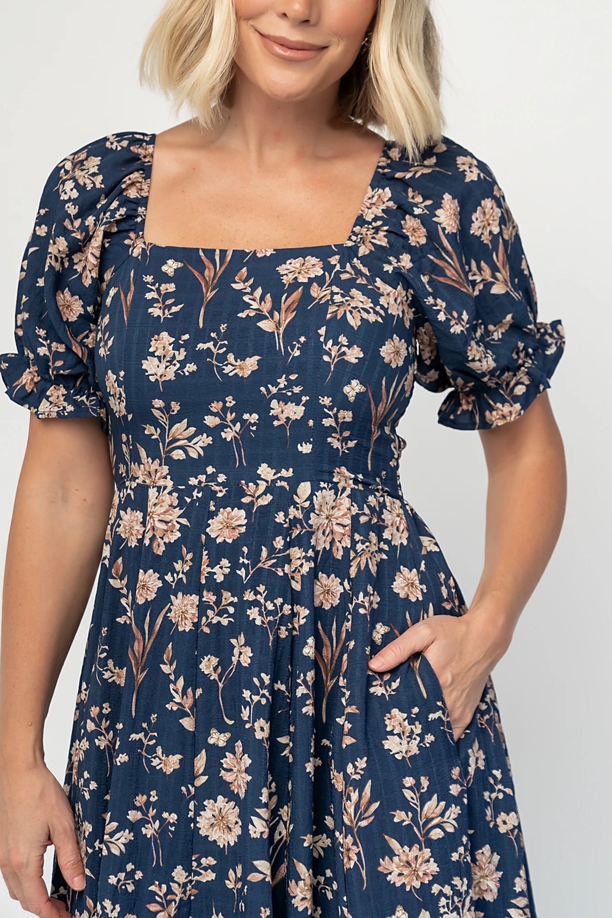 Addison Maxi Dress in Dark Blue Floral with square neckline, oversized sleeves, smocked back, and tiered ruffle skirt.