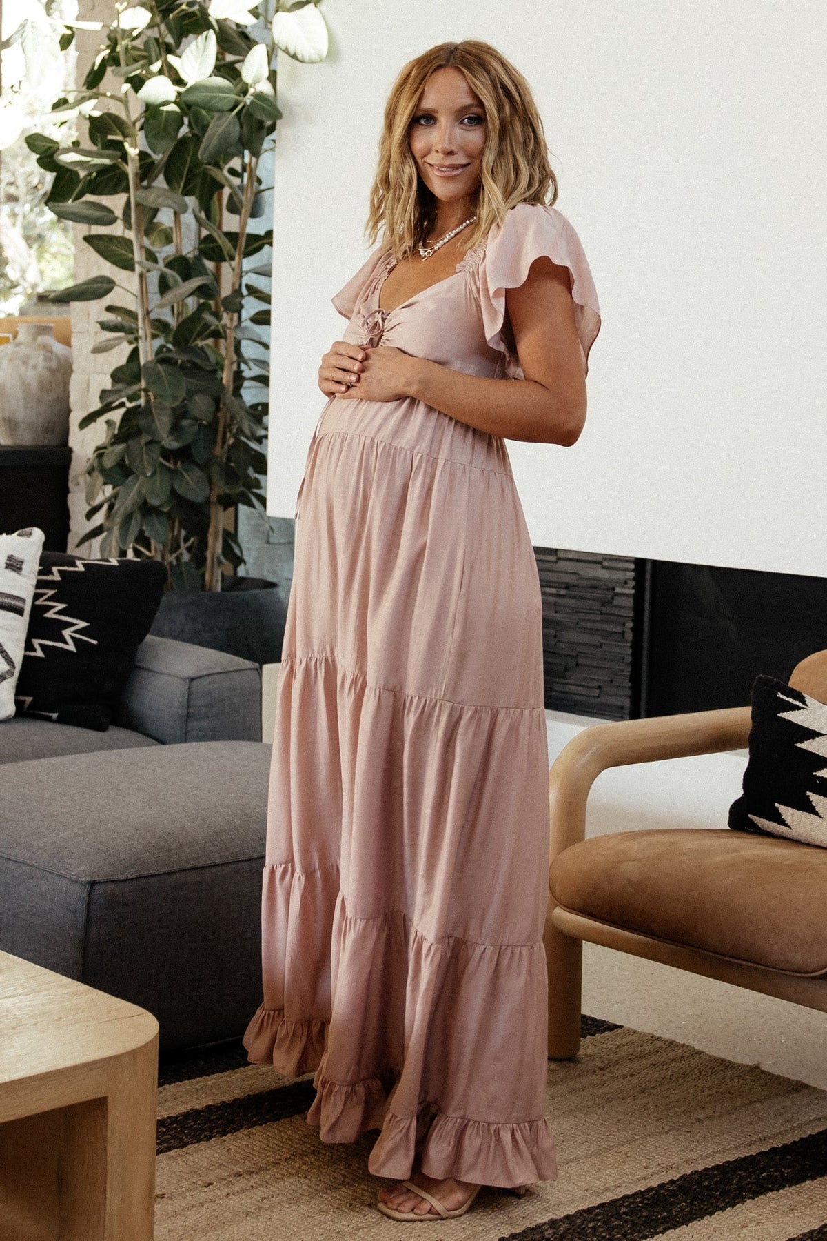Back view of Agatha Maxi Dress showing smocked back panel and lined skirt detail in dusty mauve, designed for comfortable fit and movement.