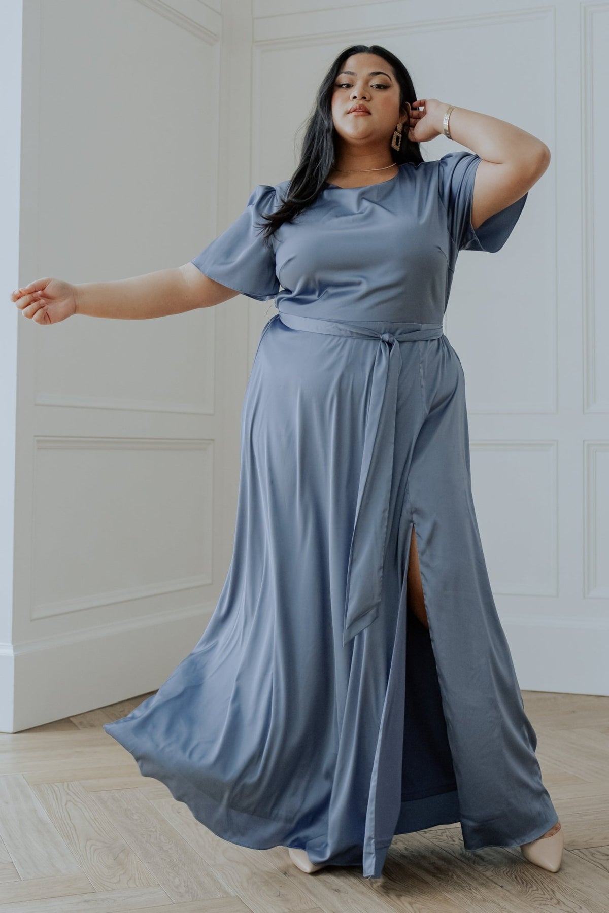 Back view of Agnes Satin Maxi Dress in whisper blue showing elastic back waist, keyhole button at neck, and clean, lined skirt construction.
