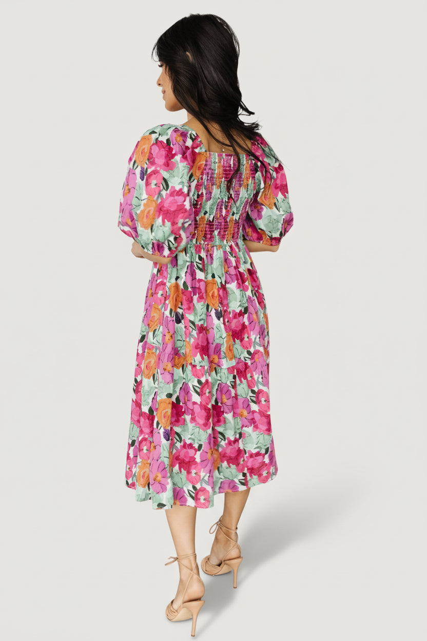 Fabric detail of pink multi floral print on the Aimee midi dress showing cotton weave and color saturation across the pattern.