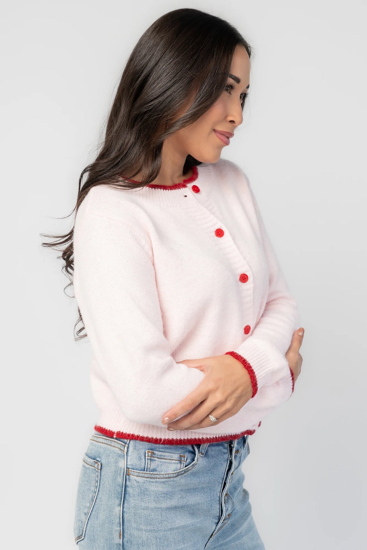 Alanna Cardigan in Blush + Red with contrasting red trim, crew neckline, red button front, and ribbed knit details.