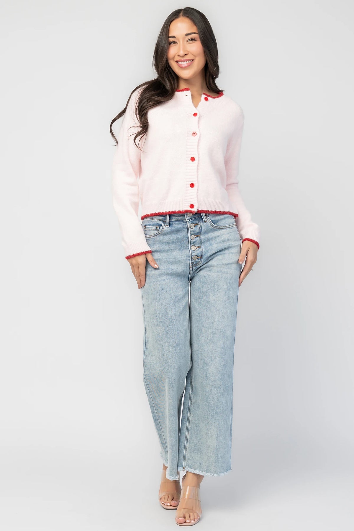 Alanna Cardigan in Blush + Red with contrasting red trim, crew neckline, red button front, and ribbed knit details.