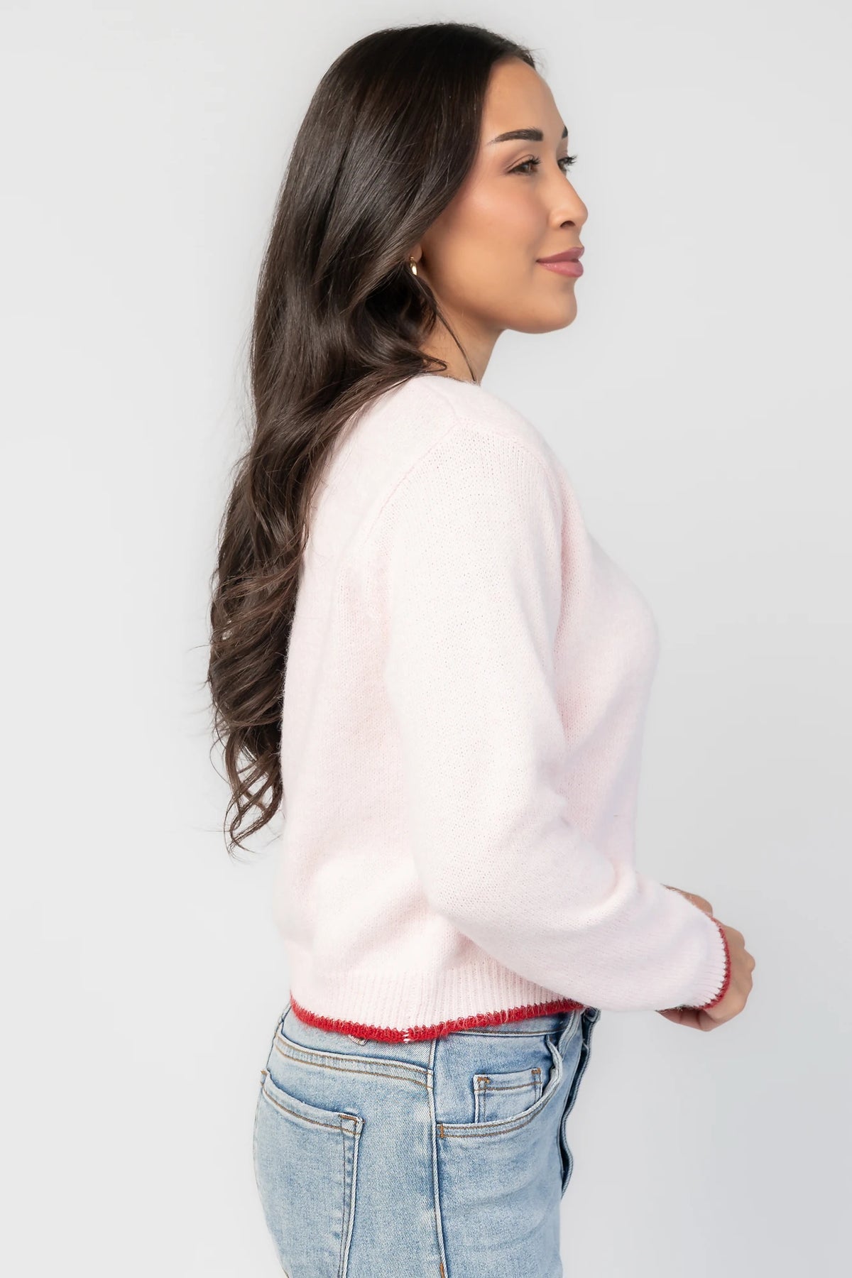 Alanna Cardigan in Blush + Red with contrasting red trim, crew neckline, red button front, and ribbed knit details.