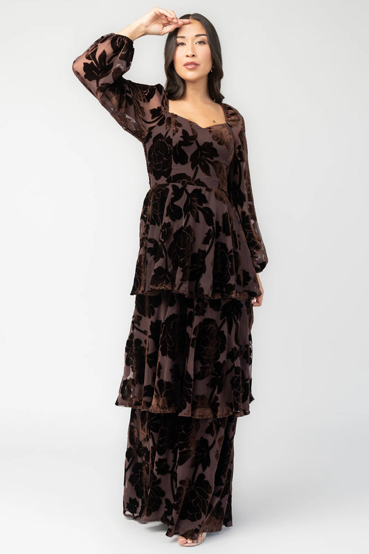 Alexandra Velvet Maxi Dress in Dark Brown with velvet florals, sweetheart neckline, long sleeves, smocked back, and flowing skirt.