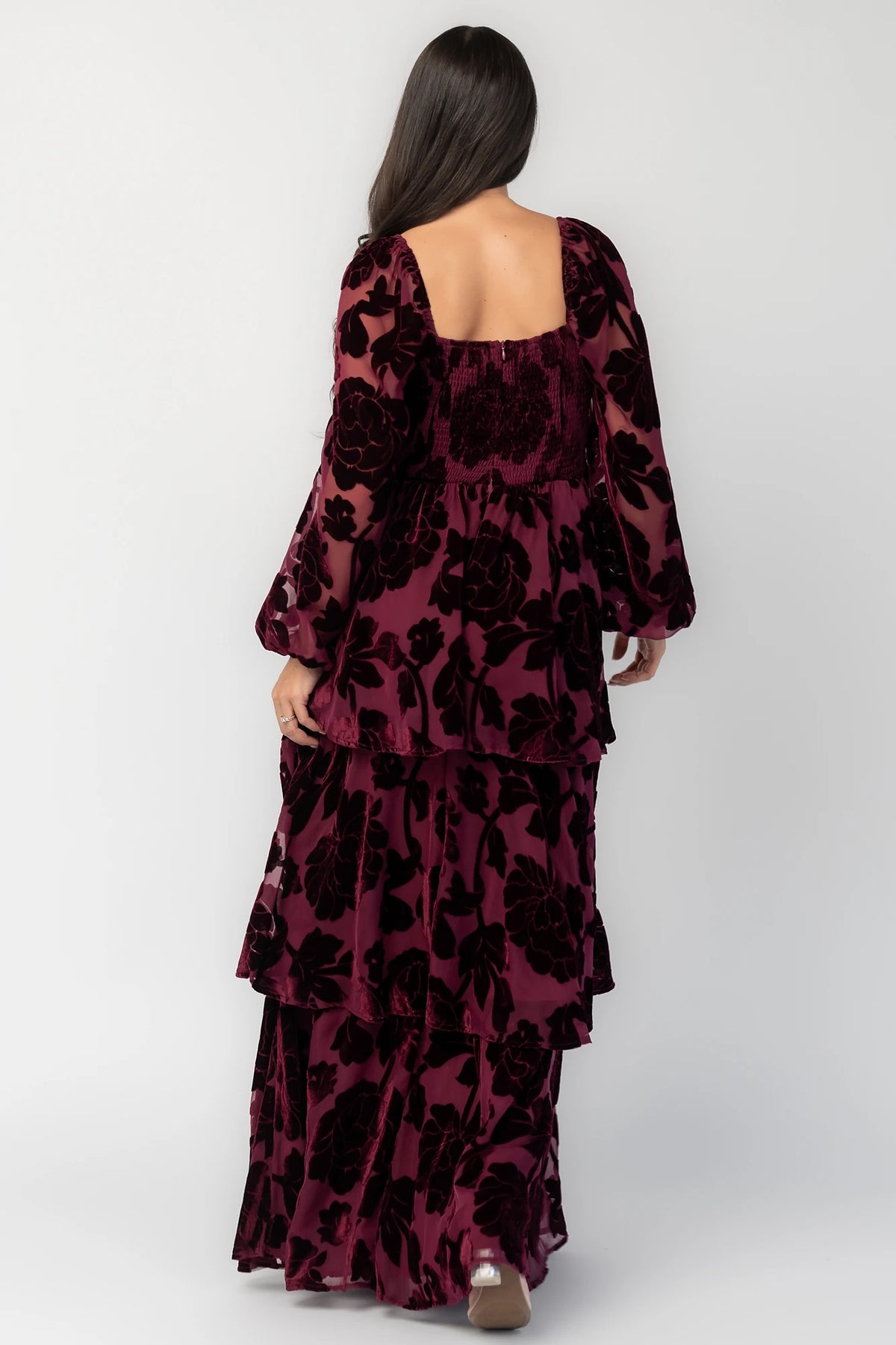 Alexandra Velvet Maxi Dress in Mulberry with velvet florals, sweetheart neckline, long sleeves, smocked back, and flowing skirt.