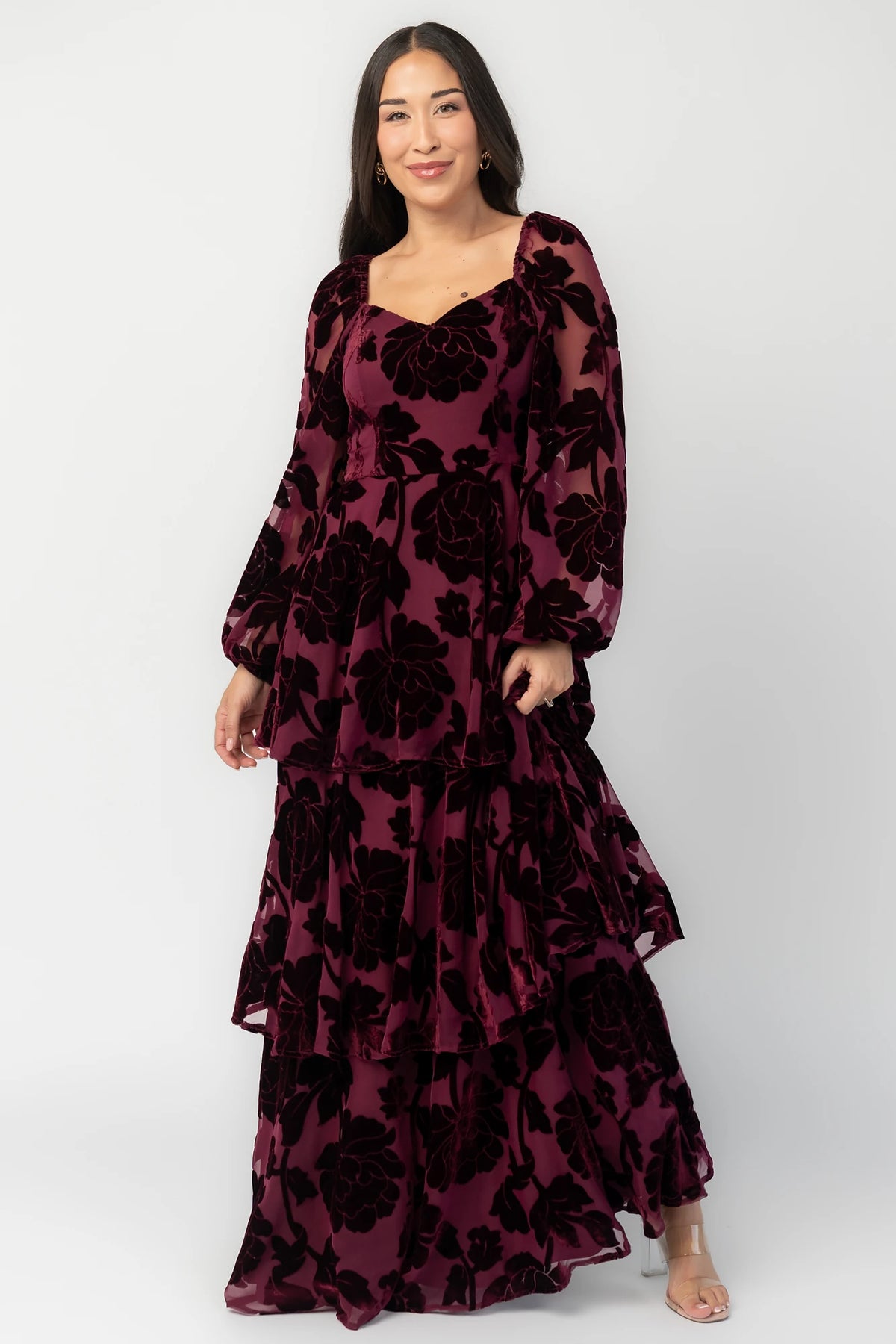 Alexandra Velvet Maxi Dress in Mulberry with velvet florals, sweetheart neckline, long sleeves, smocked back, and flowing skirt.
