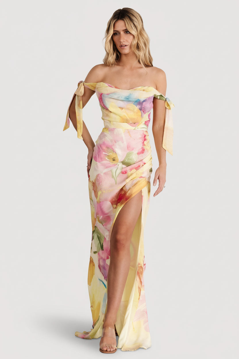 Back view of the multi-floral off-shoulder maxi dress showing hidden side zipper and fully lined construction for smooth fit.