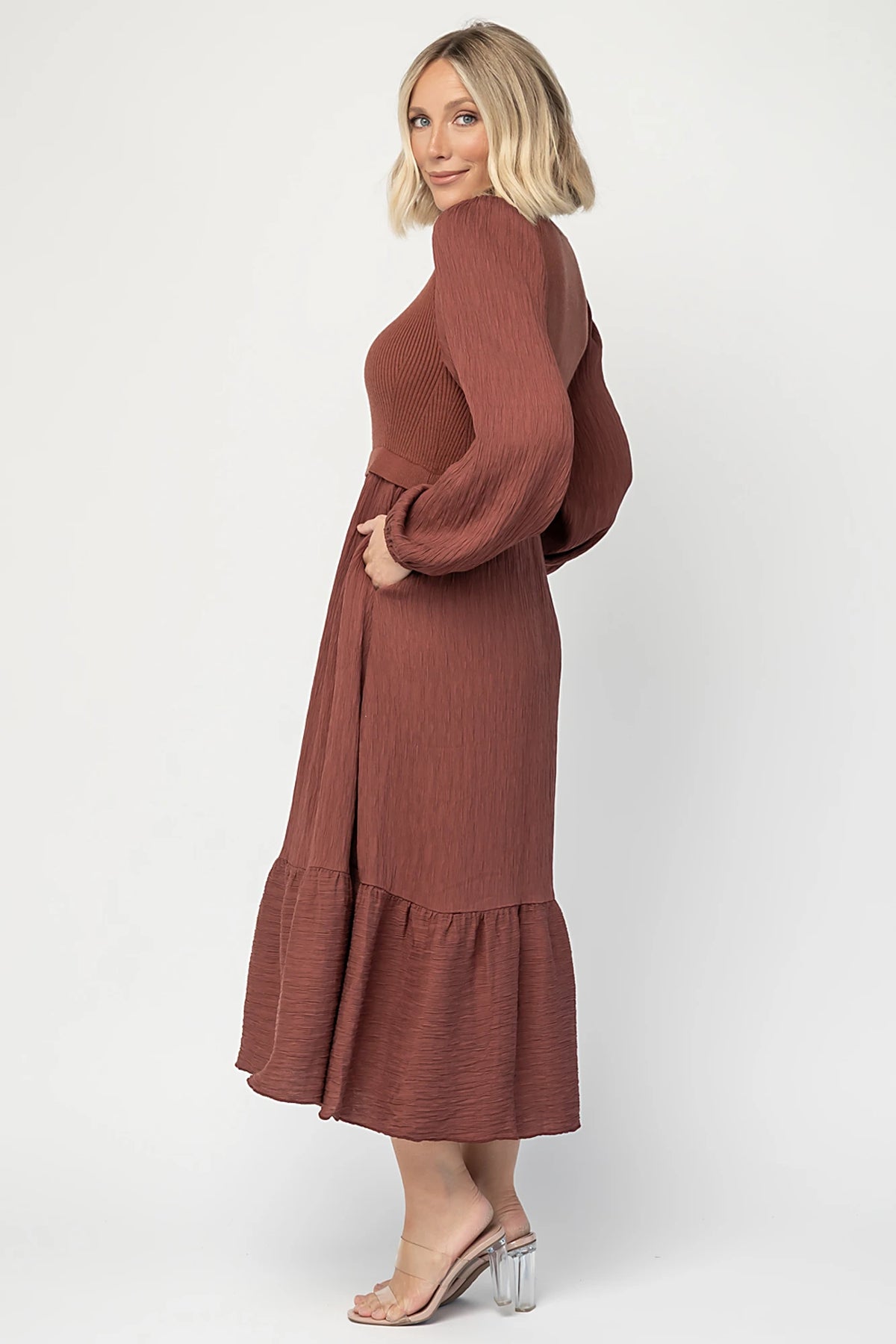 Alva Sweater Dress in Dusty Mahogany with ribbed knit bodice, square neckline, ruffle shoulders, long sleeves, and midi skirt.