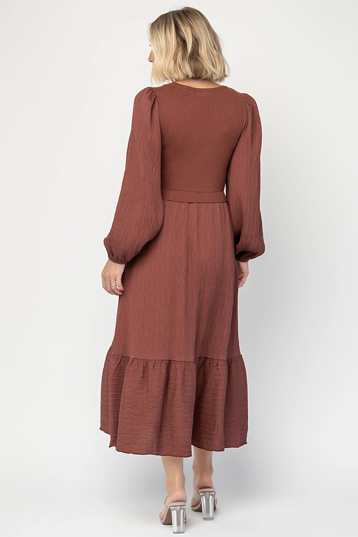 Alva Sweater Dress in Dusty Mahogany with ribbed knit bodice, square neckline, ruffle shoulders, long sleeves, and midi skirt.