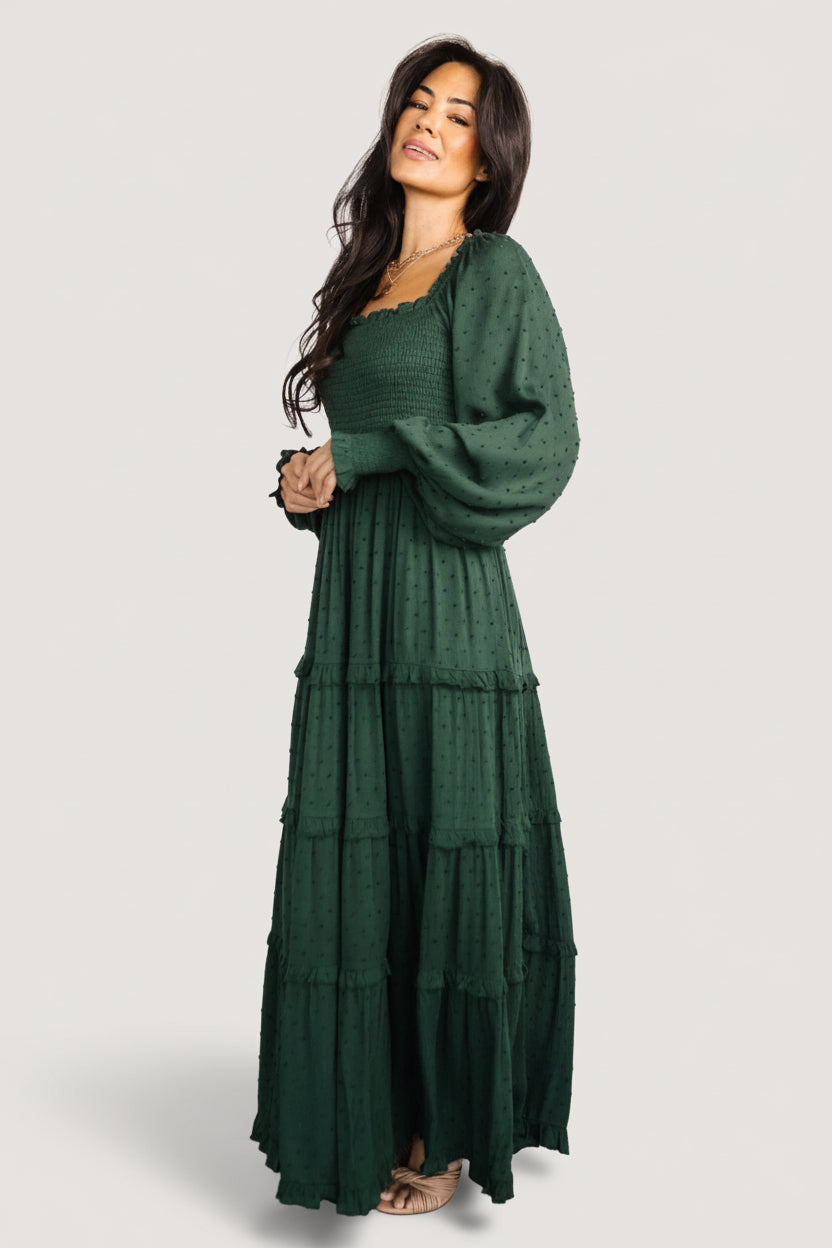 Detail image of sleeve cuff and smocking on the evergreen dress illustrating the unlined sleeve and elastic finish at cuff.