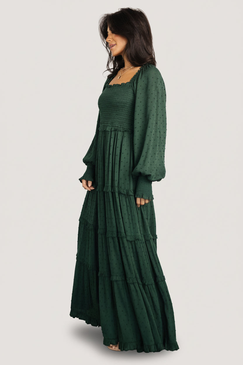 Fabric drape and movement detail of the dotted rayon material in evergreen, highlighting lightweight flow and texture.