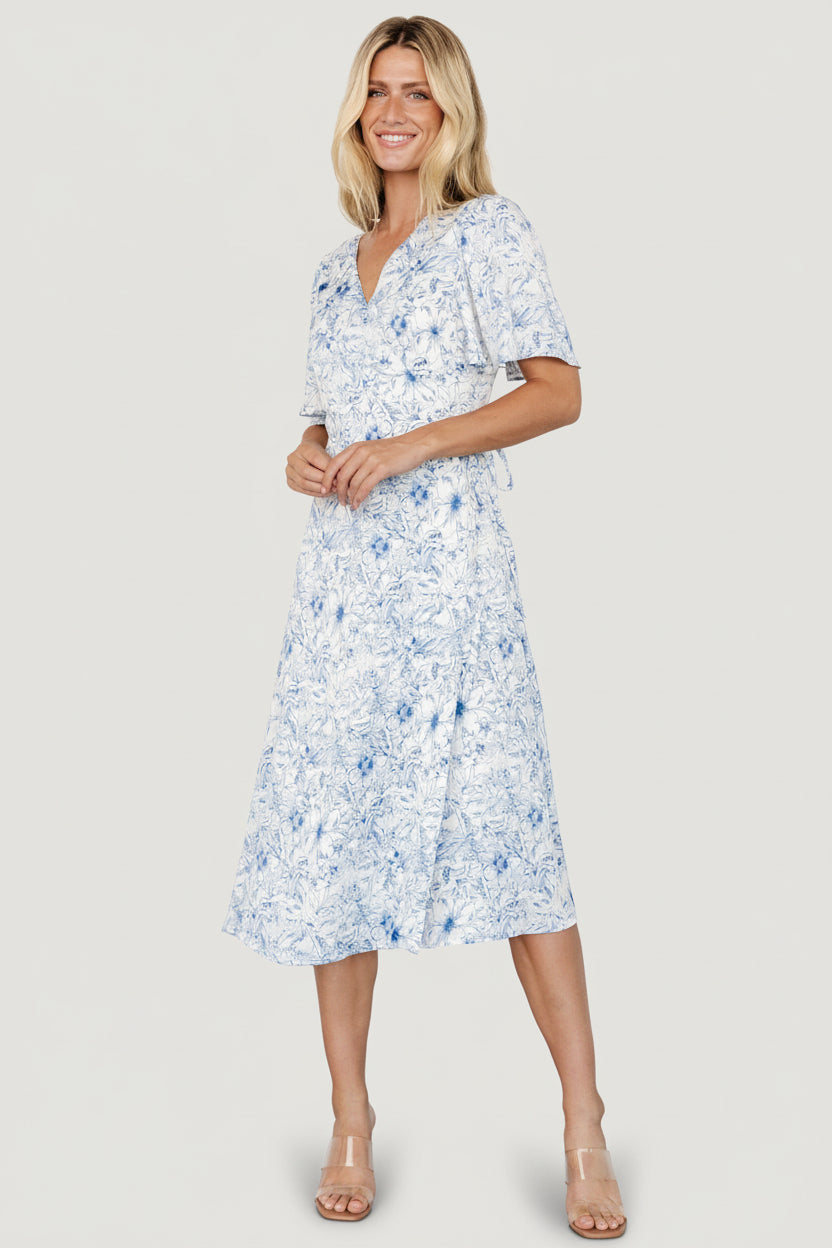 Studio image of Amelie Wrap Midi Dress on mannequin, highlighting true wrap design and fitted, lined bodice.