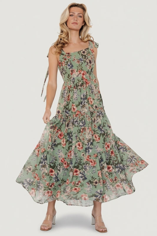 Front view of Anita Maxi Dress in green multi floral, chiffon overlay, square neckline, smocked back, and three ruffled tiers for flowy movement.