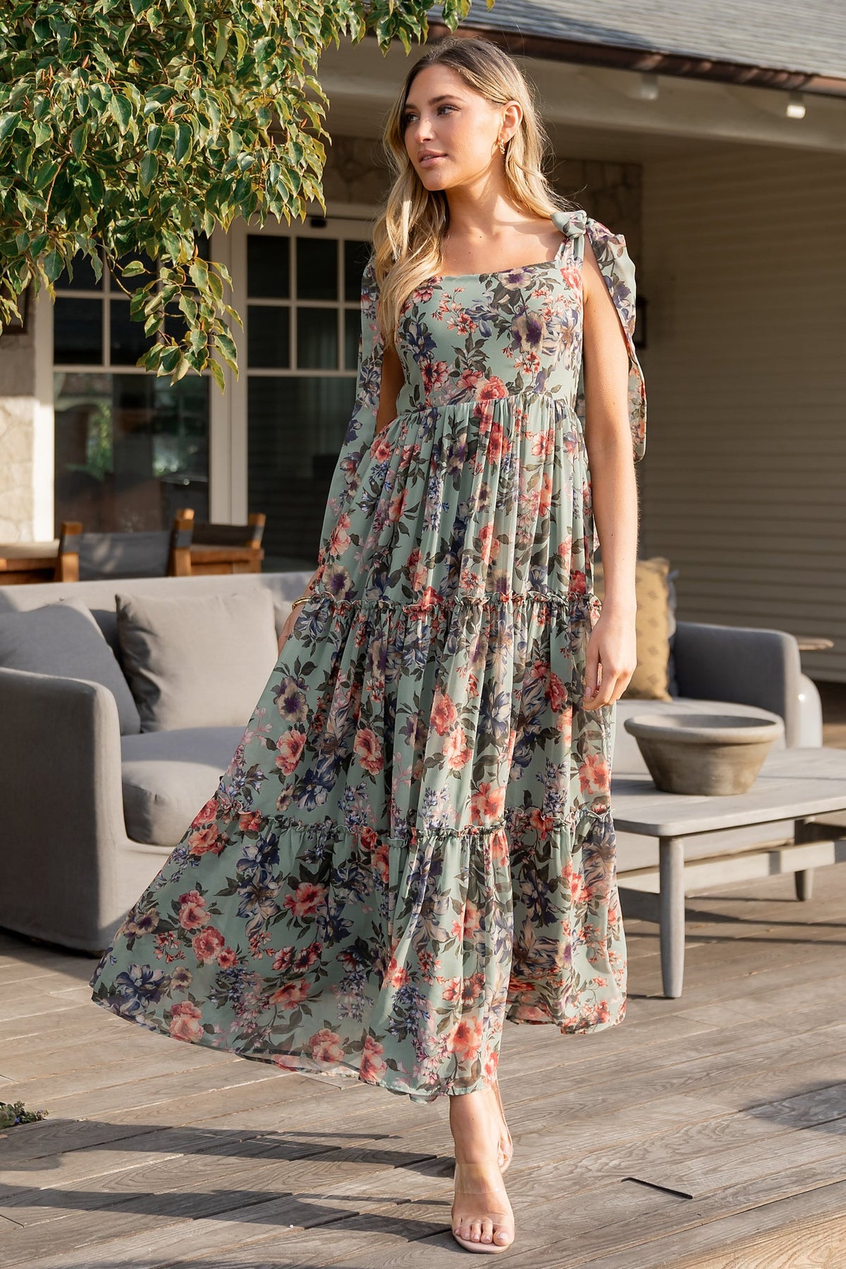 Close-up of Anita Maxi Dress bodice detailing: square neckline, paneled front, smocked back, and delicate chiffon fabric texture in green floral print.