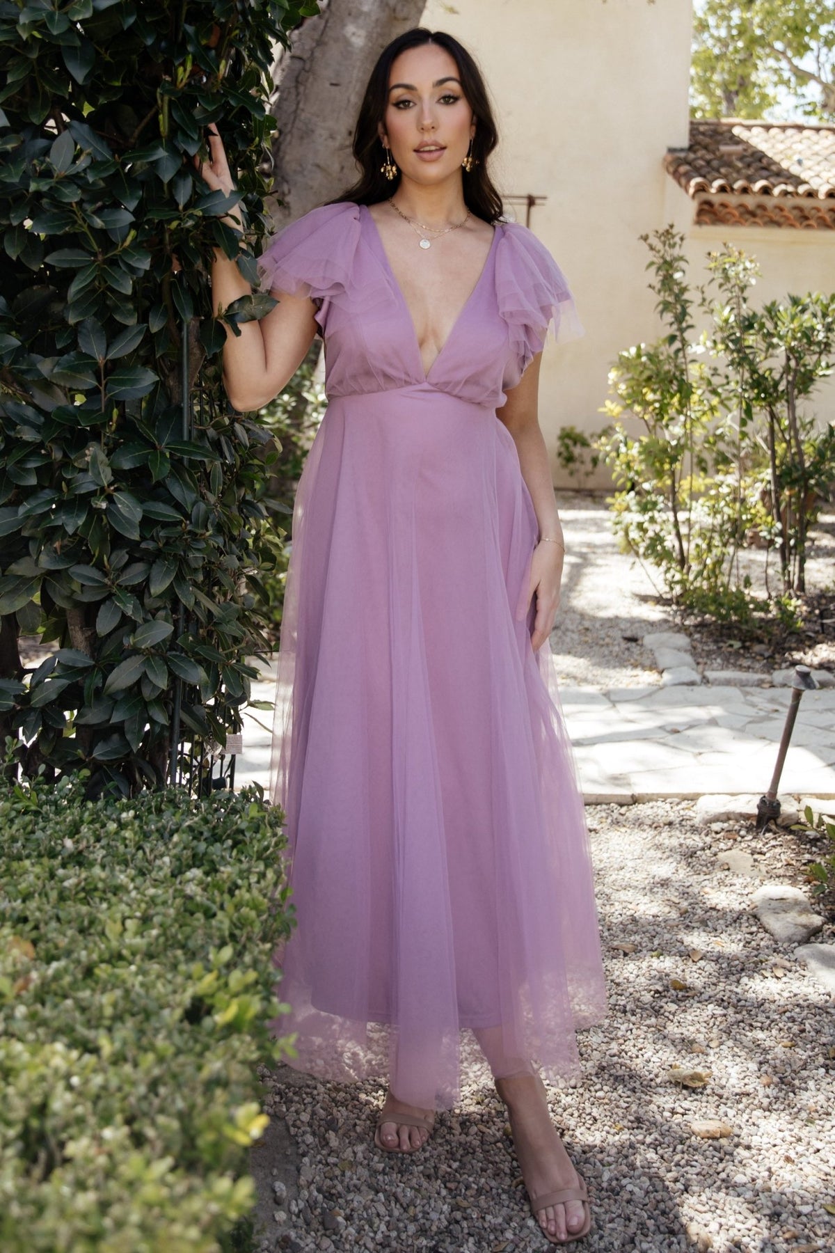 Model wearing Annabella Tulle Midi Dress in lavender showing side profile, layered tulle skirt, removable waist tie, and satin-lined interior for comfort.