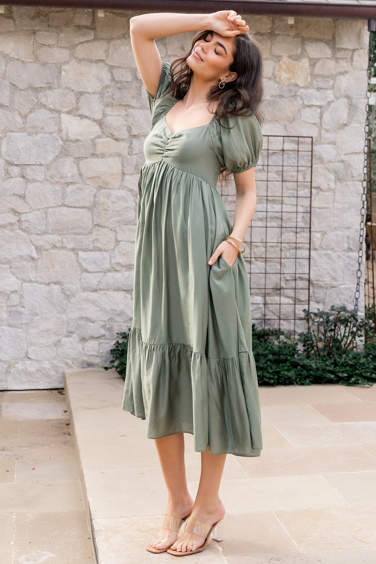 Close-up of Annalisa dress fabric and smocked back bodice in dusty olive, showing texture and elasticized shoulder detailing.