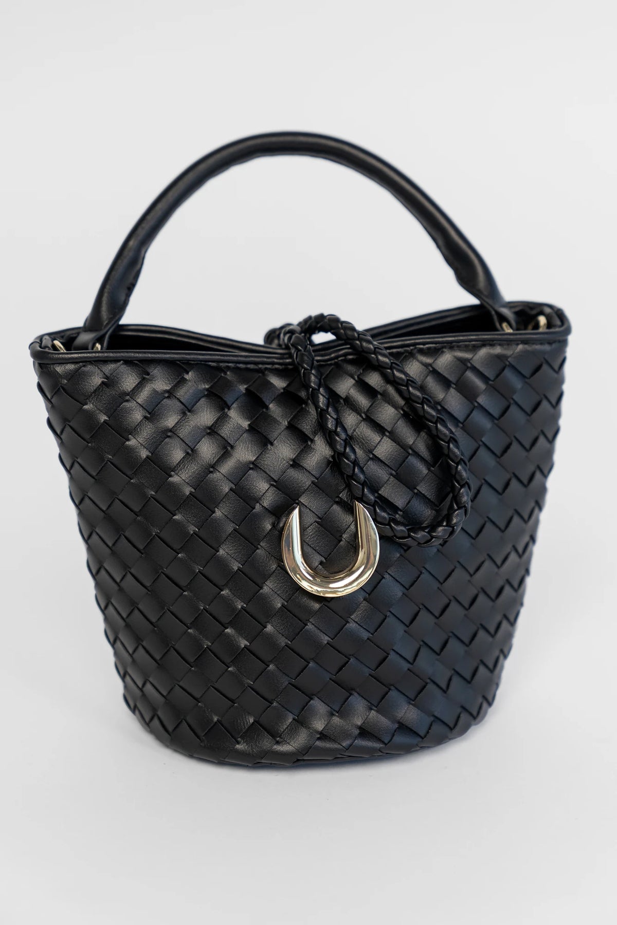 Annette Woven Tote Bag in Black with an allover woven design, structured top handles, and a gold-tone accent.