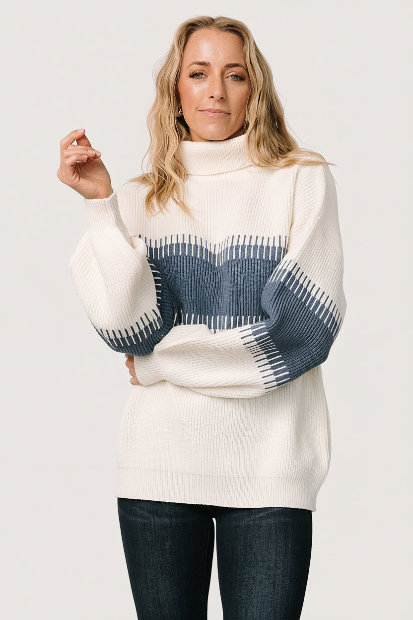 Back view of the Antonov sweater in blue and cream, showing full-coverage back, relaxed hemline, and consistent colorblock across the garment.