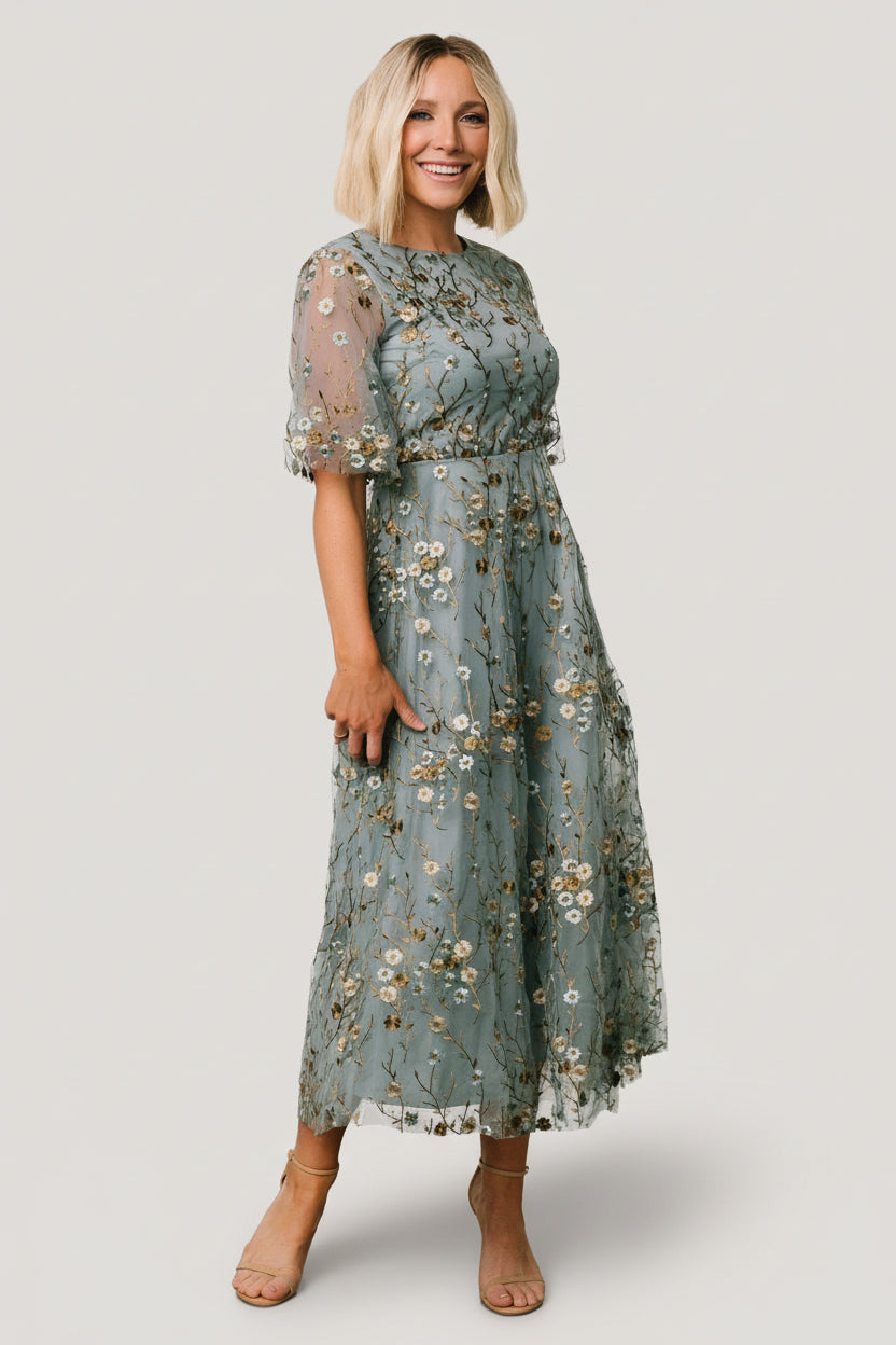 Front view of Arabella dusty blue maxi dress, embroidered gold and ivory florals on sheer tulle overlay with lined bodice.