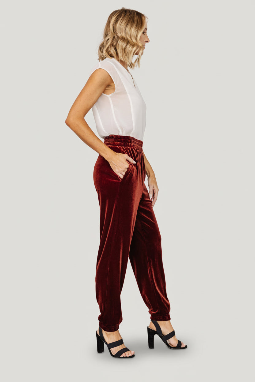 Cuffed ankle detail of Archie velvet joggers in cinnamon, showing the tapered finish and cozy fit at the hem.