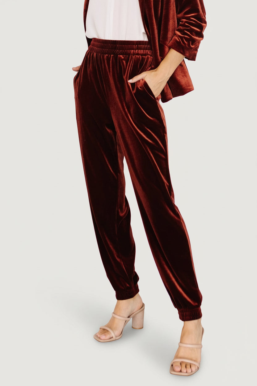 Model styling shot with Archie cinnamon joggers paired with a casual top and sneakers, showing overall silhouette.