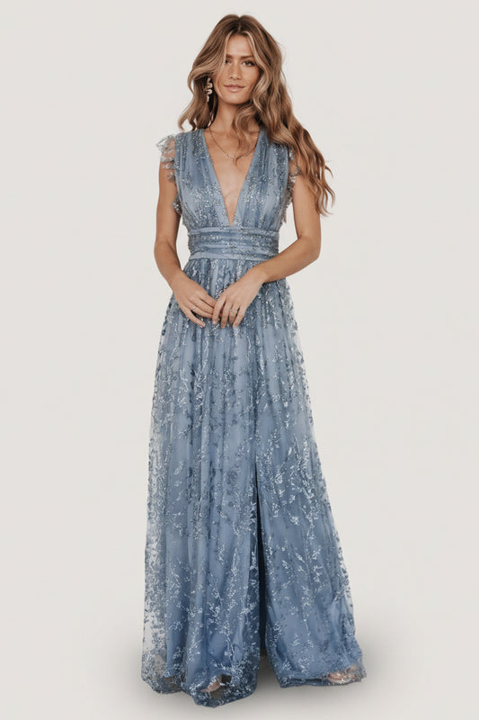 Full-length view of the Arlene Shimmer Gown in Winter Blue on a model, showing the shimmer tulle overlay, deep V-front and maxi silhouette.