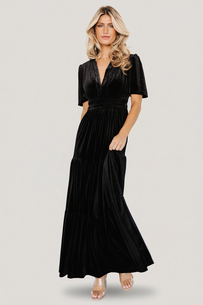 Artemis black velvet maxi dress on model, detail of bodice and elastic waist with gentle gathers and flattering drape.
