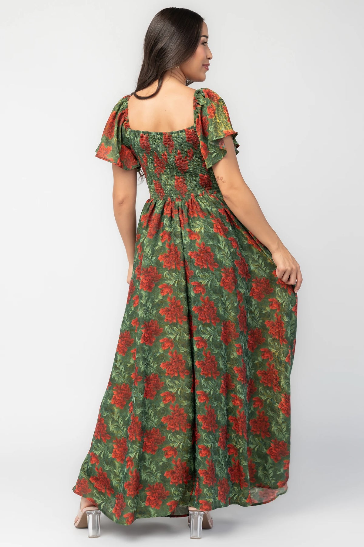 Astor Maxi Dress in Green + Red with floral print, sweetheart neckline, flutter sleeves, smocked back, and flowing skirt.