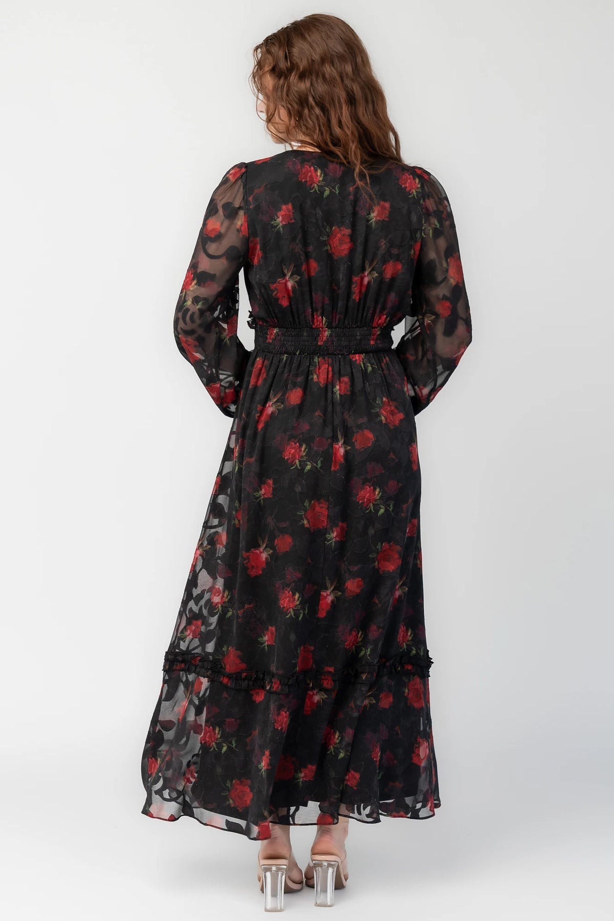 Avalora Midi Dress in Black Rose Floral with V-neckline, sheer long sleeves, smocked waist, and ruffle tier.