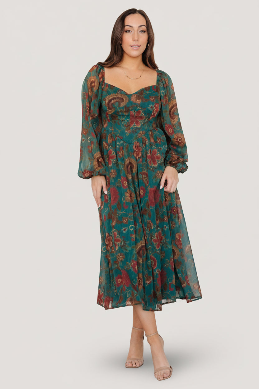 Sleeve detail showing long bishop sleeve with elastic cuff on the Babette Basque Waist midi dress in teal and rust floral print.