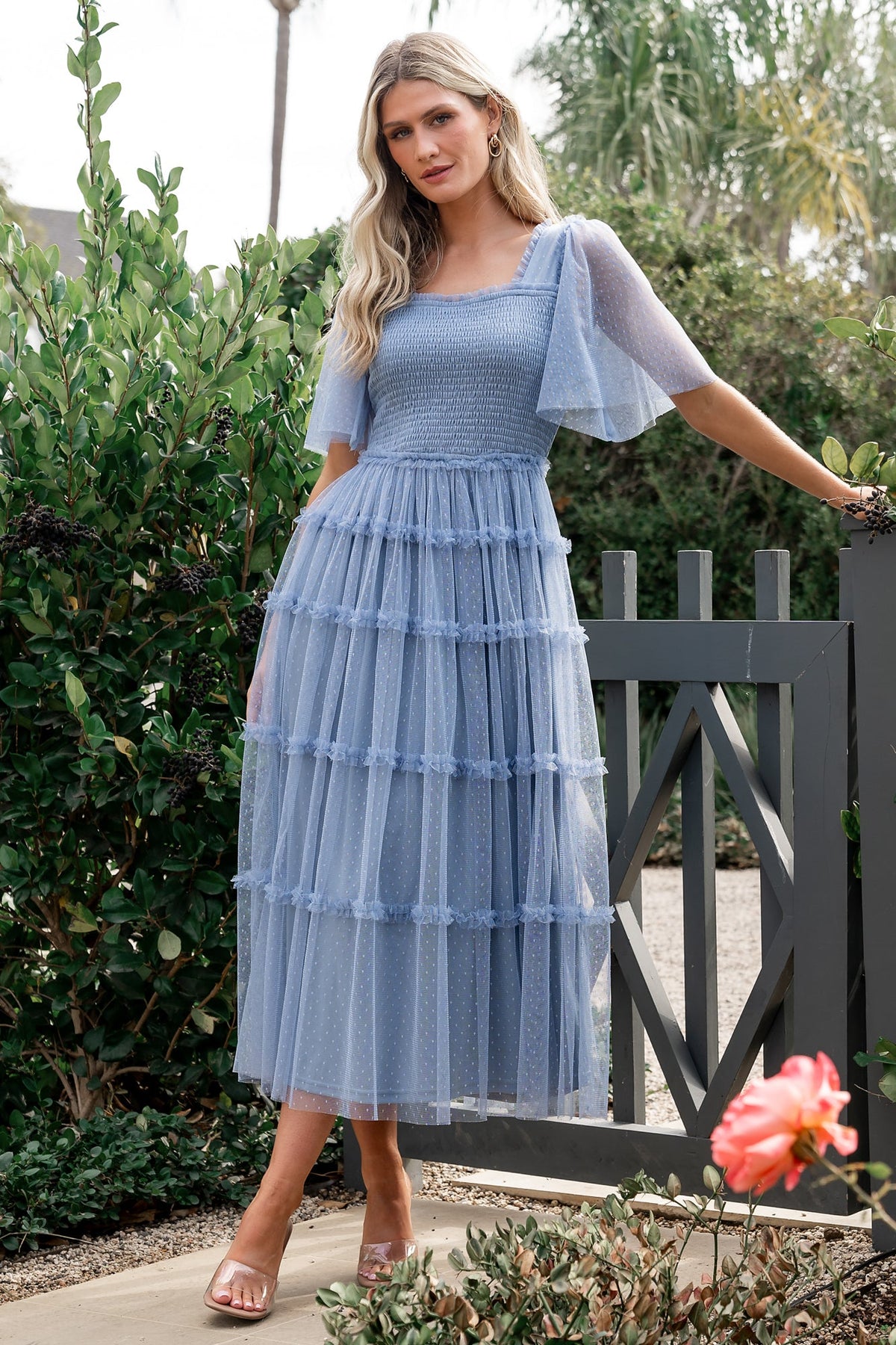 Close-up of sheer short tulle sleeve detail showing double-layer construction, dotted texture and soft lined underlayer.