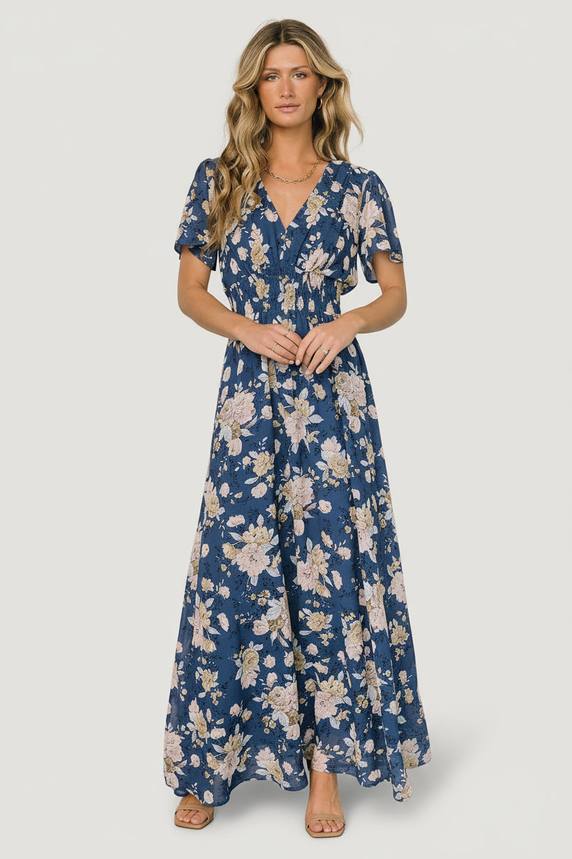 Movement shot of Birdie maxi dress showing full skirt swing and lightweight chiffon-style polyester construction for travel and events.
