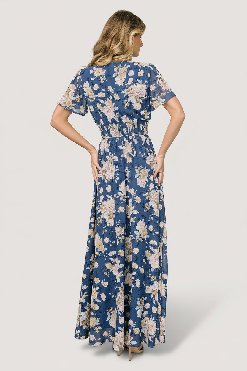 Detail shot of the smocked waistband and V-neck of the Birdie maxi dress, showing secure stitching and soft, non-itch lining.