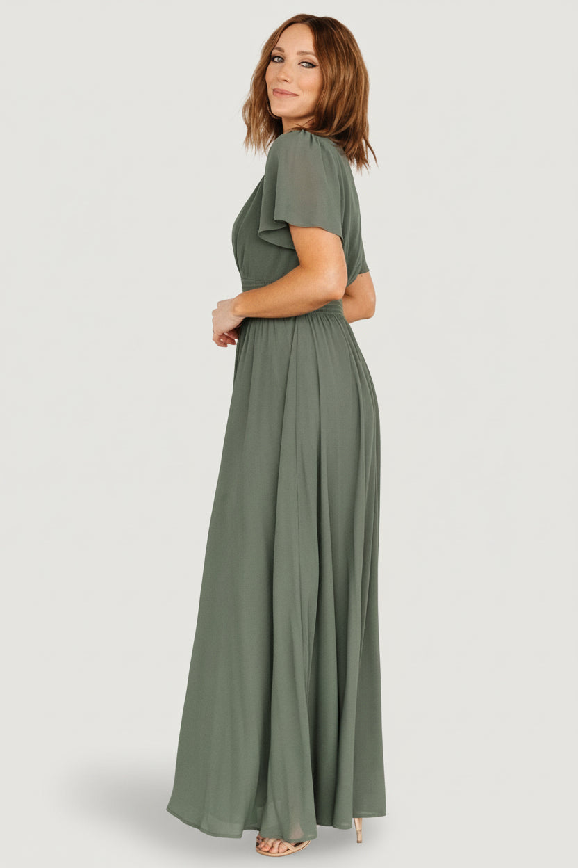 Detail shot of the short flutter sleeve and V-neckline on the Birdie Maxi Dress in dark sage, showing lightweight chiffon and stitchwork.