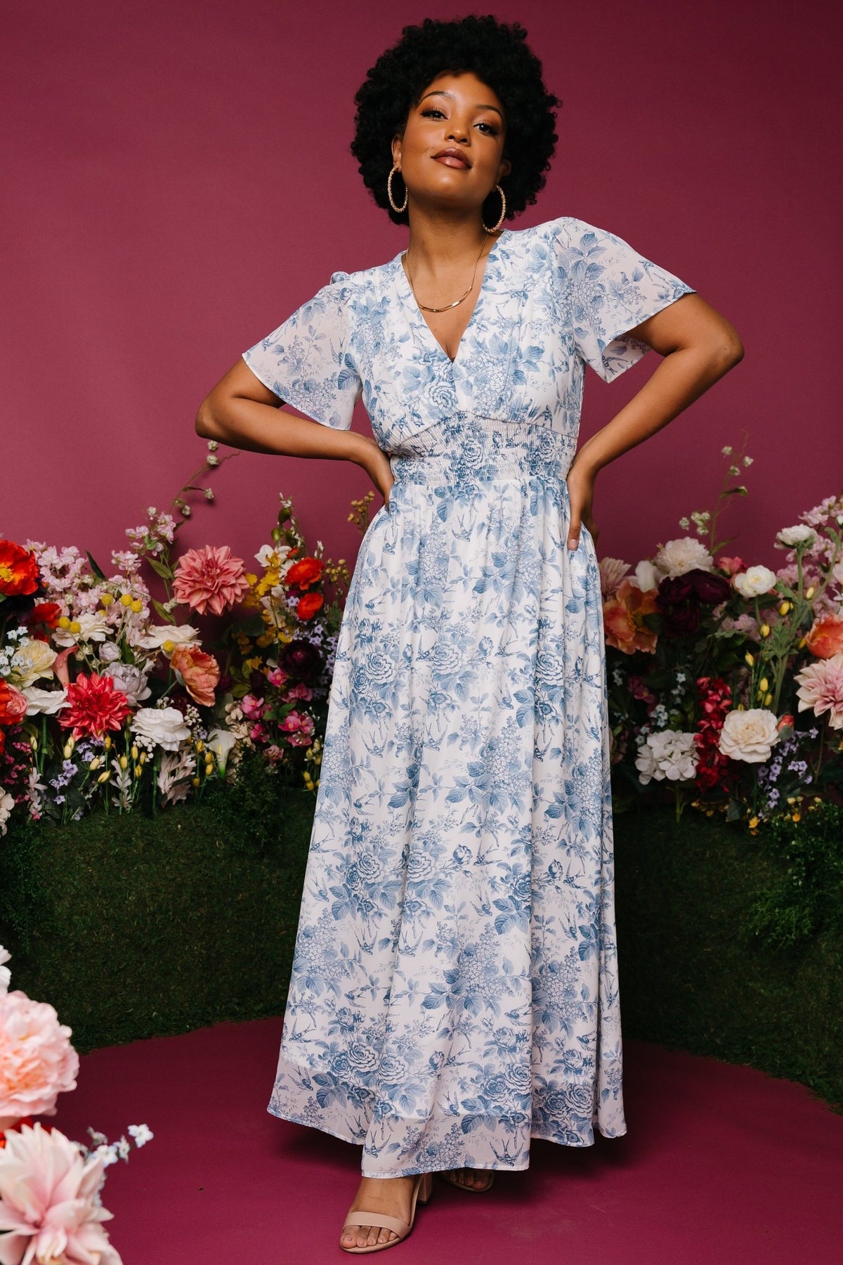 Back view of the off-white chiffon maxi dress highlighting gentle drape, full lining through the body, and unlined sleeves.
