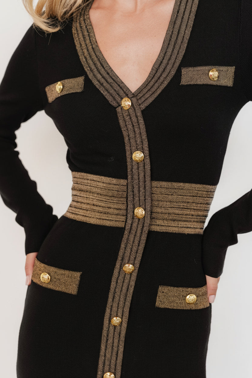 Side view highlighting the slight gathering at waist, midi skirt silhouette and raw hem for a modern, tailored finish.