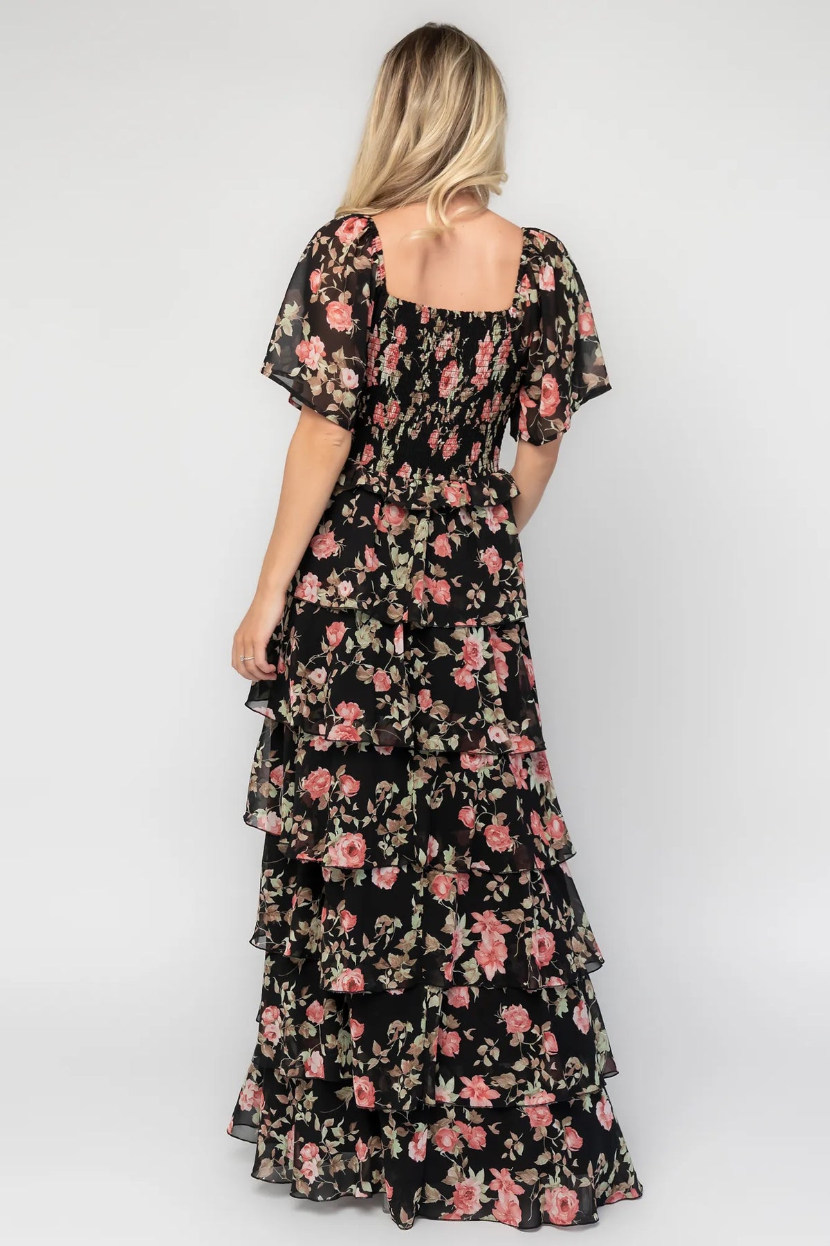 Bliss Tiered Maxi Dress in Black Multi Floral with square neckline, flutter sleeves, smocked back, and tiered maxi skirt.