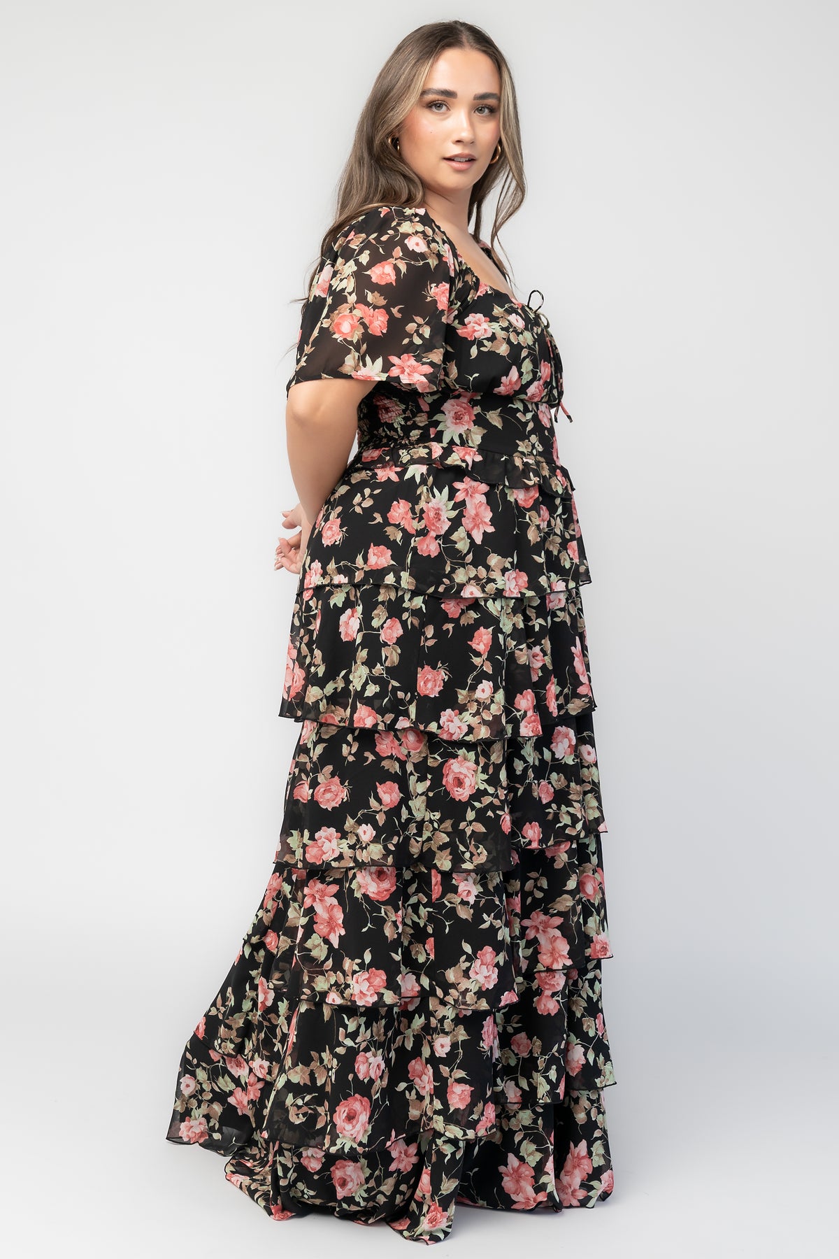 Bliss Tiered Maxi Dress in Black Multi Floral with square neckline, flutter sleeves, smocked back, and tiered maxi skirt.
