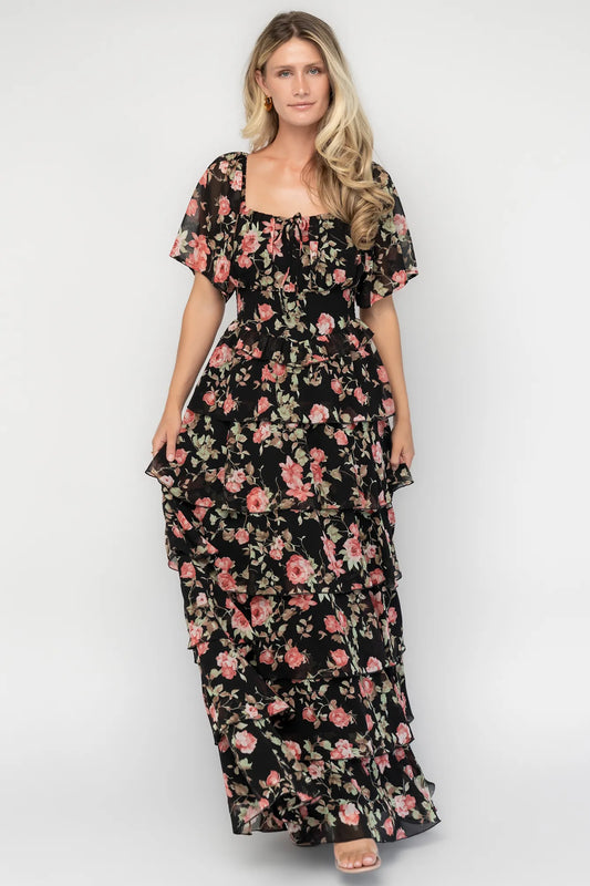 Bliss Tiered Maxi Dress in Black Multi Floral with square neckline, flutter sleeves, smocked back, and tiered maxi skirt.