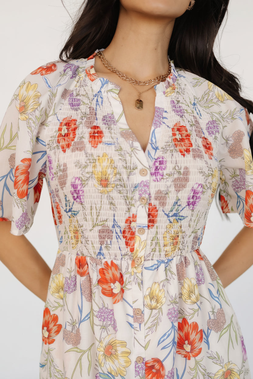 Close-up of the notched ruffled collar and functioning button-up front on the ivory floral rayon Botega Midi Dress, showing print detail.