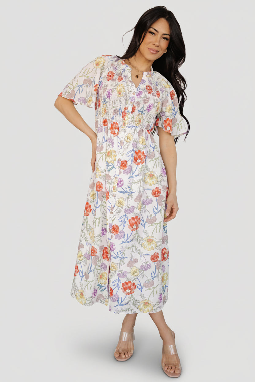 Fabric and lining close-up of the ivory floral Botega Midi Dress showing lightweight rayon self-fabric and smooth polyester lining.