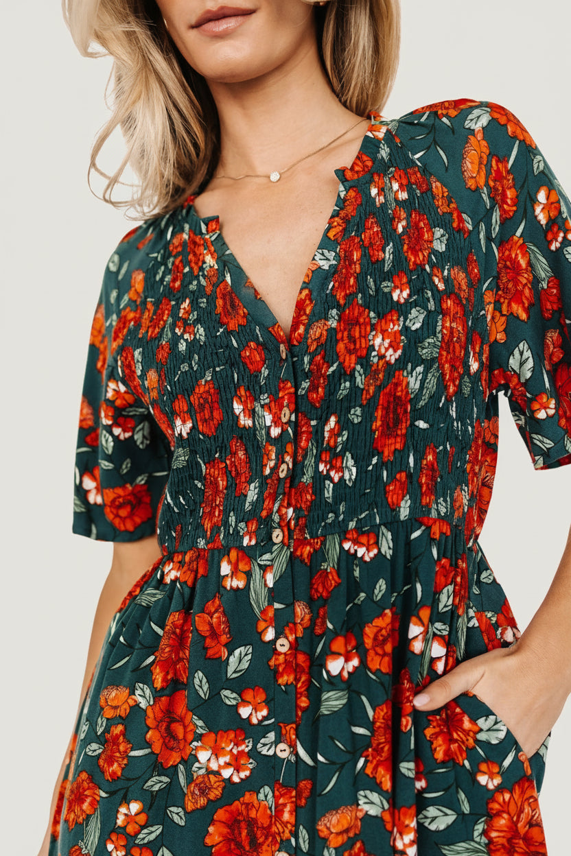 Side view close-up of Polagram Botega Midi Dress in jade multi floral showing short sleeves, smocked front bodice, and ruffle-trimmed neckline.
