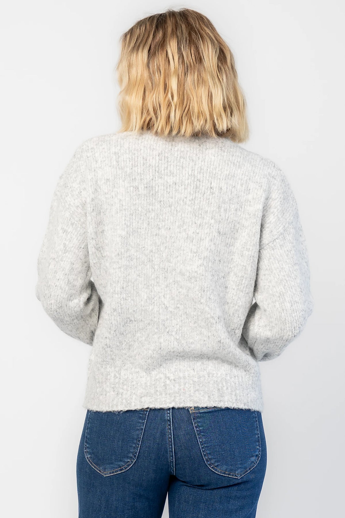 Bow Sweater in Gray with a sparkling sequin bow at the front, a crew neckline, and a heathered knit finish.