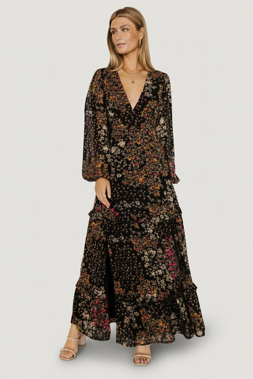 Bowman Deep V Tiered Maxi Dress in Black Multi with deep V-neck, long sleeves, ruffle-tiered skirt, and leg slit.