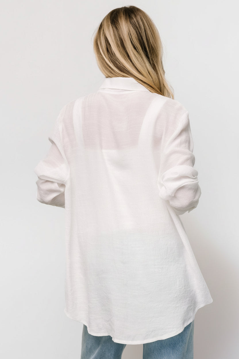 Model wearing Breck Button Up Top in off white; relaxed fit, collar neckline, and single left bust pocket visible.